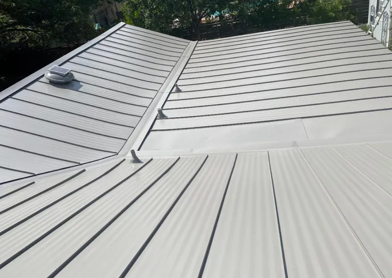 Solar attic fan installed on a metal roof for Roof Ventilation in Leavenworth